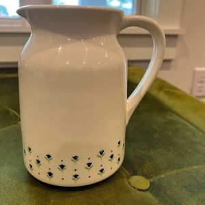 Lillian Vernon cream colored pitcher with small blue tulips.